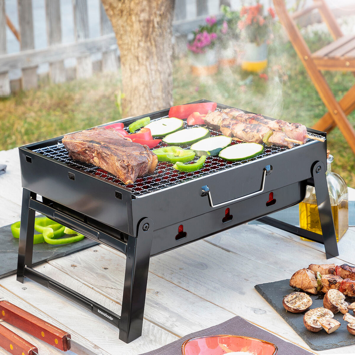 Barbecue pliable et portable à charbon de bois