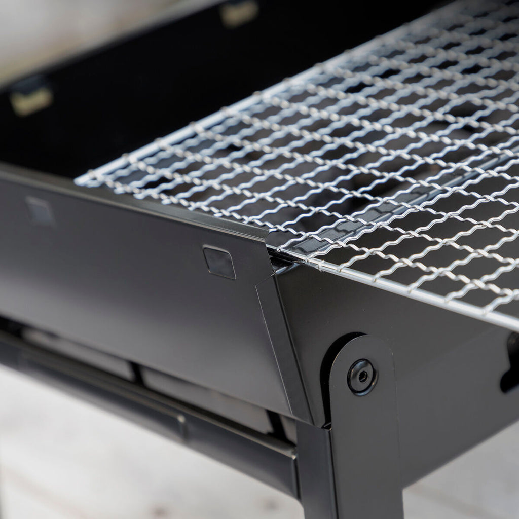 Barbecue pliable et portable à charbon de bois
